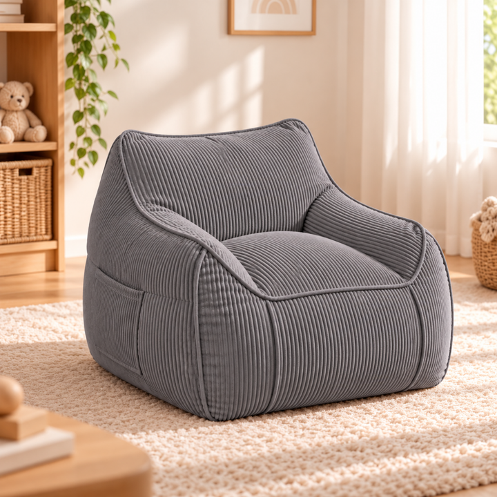 Pouf Fauteuil enfant en velours côtelé gris foncé, dans une chambre
