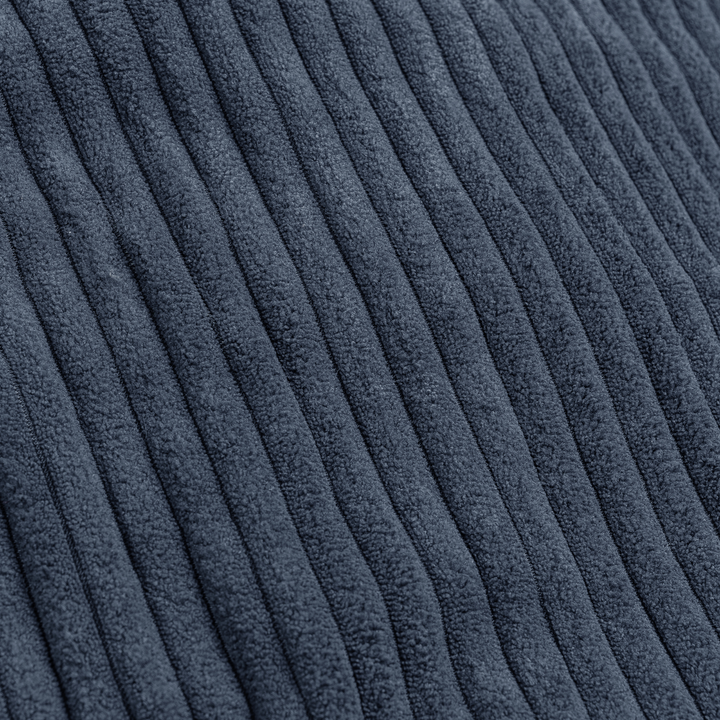Détail du tissu velours côtelé du pouf poire déhoussable, relief des côtes.