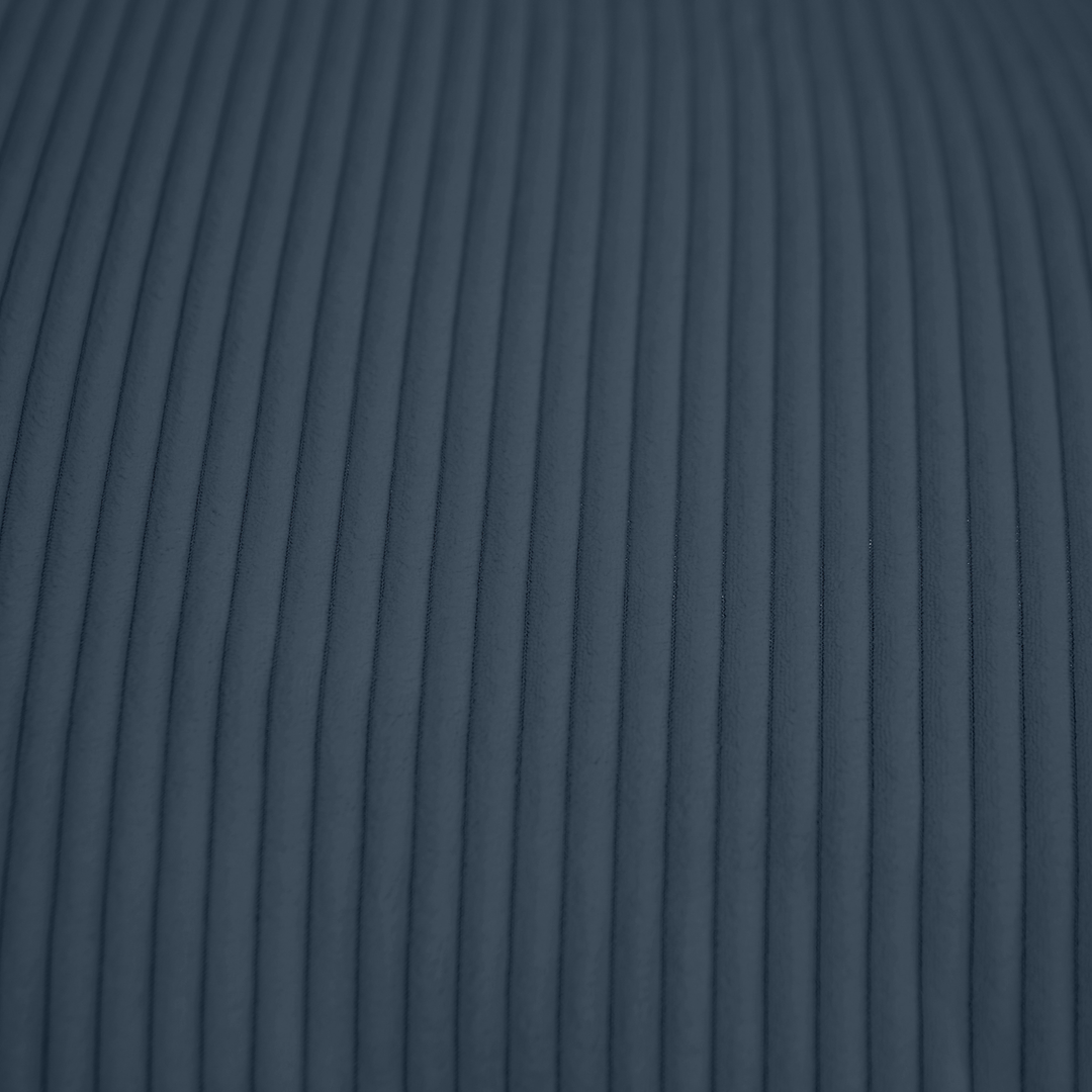 Tissu velours côtelé bleu nuit, gros plan sur les reliefs de la housse.