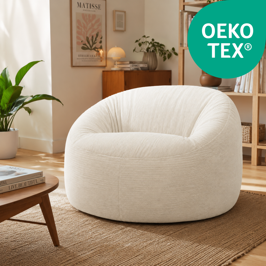 Pouf déhoussable rond en velours côtelé écru avec certification OEKO-TEX®.