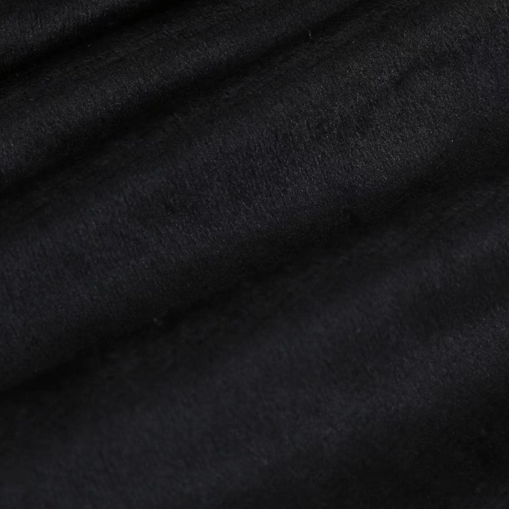 Velours noir en gros plan, texture du tissu