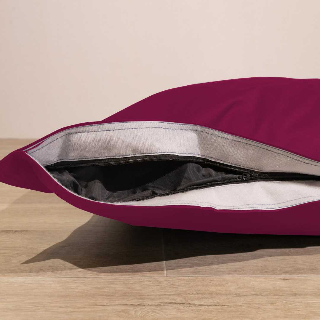 Détail de la housse amovible du pouf extérieur déhoussable 140x180 cm avec fermeture éclair.