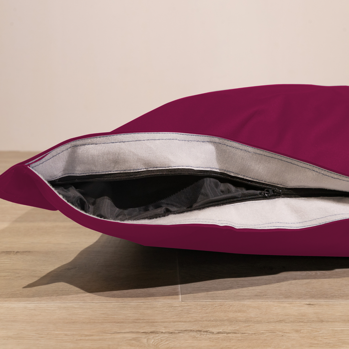 Détail de la housse amovible du pouf extérieur déhoussable 140x180 cm avec fermeture éclair.