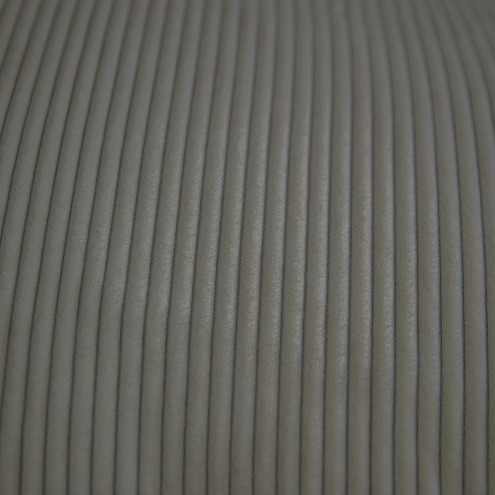Détail du velours côtelé du pouf déhoussable, gris foncé, reliefs réguliers.