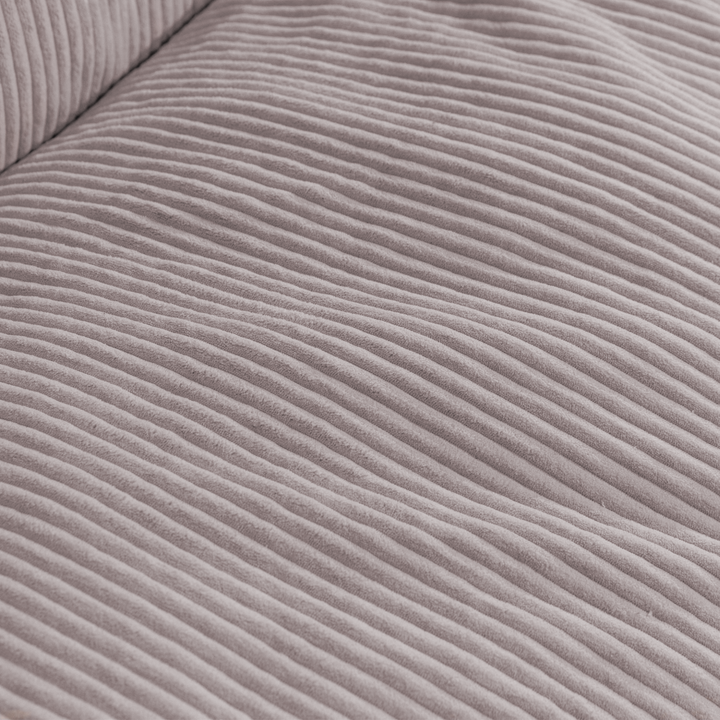 Gros plan du tissu en velours côtelé épais du pouf