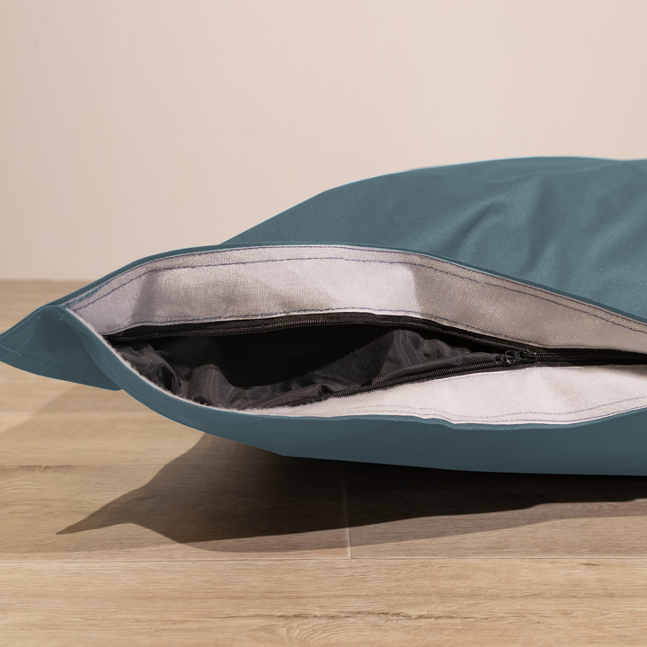 Détail de la housse amovible du pouf extérieur déhoussable 140x180 cm avec fermeture éclair.