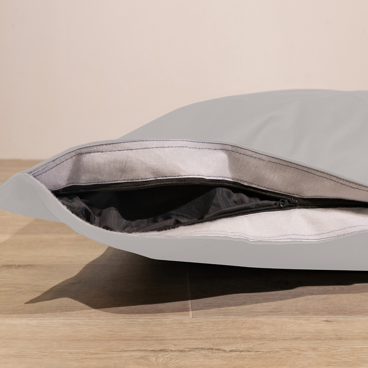 Détail de la housse amovible du pouf extérieur déhoussable 140x180 cm avec fermeture éclair.